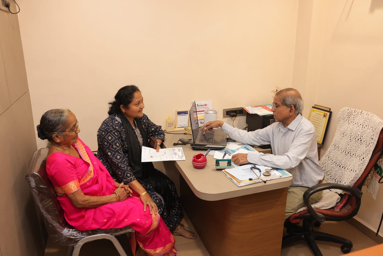 Doctor in consultation with patients